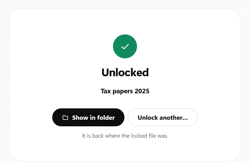 The Unlocked card: a green tick, Tax papers 2025, Show in folder and Unlock another, and the note It is back where the locked file was.